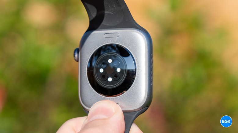 Close-up of the sensor array on the underside of the Apple Watch Series 11.