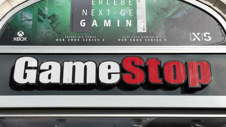 The exterior signage of a GameStop retail store on a modern building.