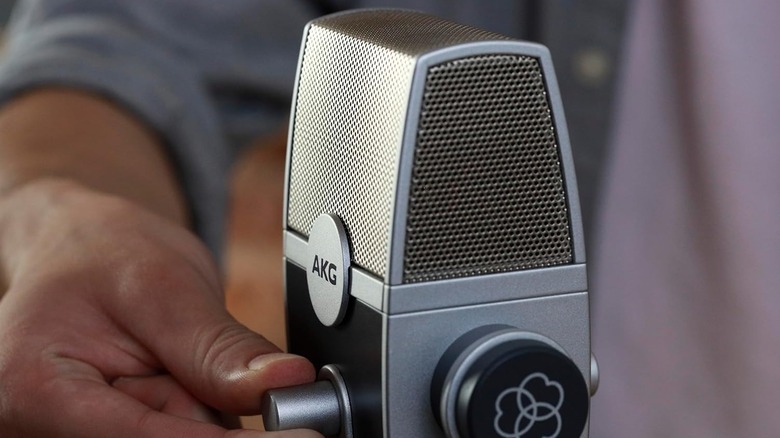 A silver AKG Pro Audio Lyra vintage-style USB microphone on a desktop stand.