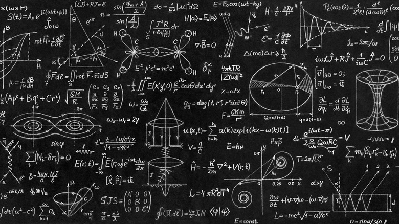 A blackboard filled with complex mathematical equations.