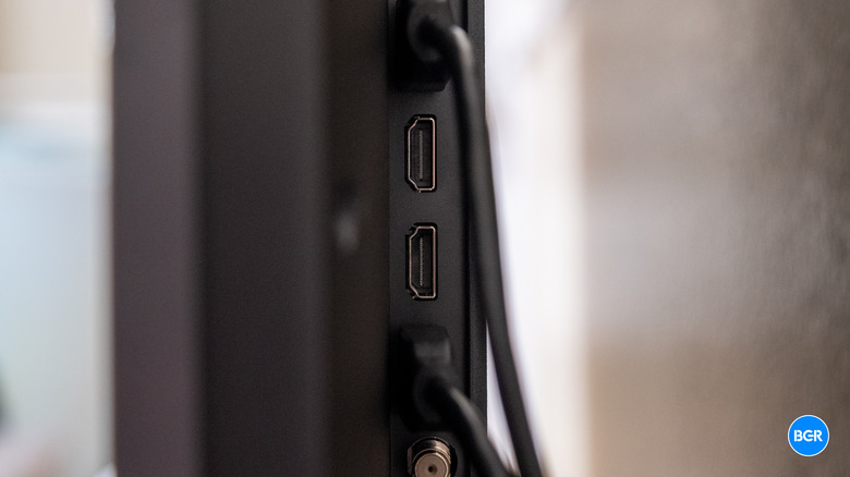 Rear port panel of the TCL QM6K highlighting the HDMI 2.1 inputs.