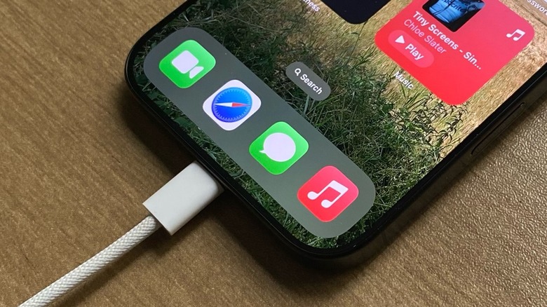 An iPhone charging with a premium braided Apple USB-C cable