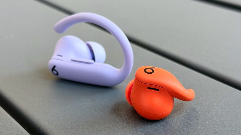 Comparison shot of the hook-design Powerbeats Pro 2 next to the wingtip-design Powerbeats Fit.