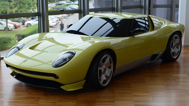 The Lamborghini Miura Concept showcasing its iconic mid-engine proportions and classic curves.
