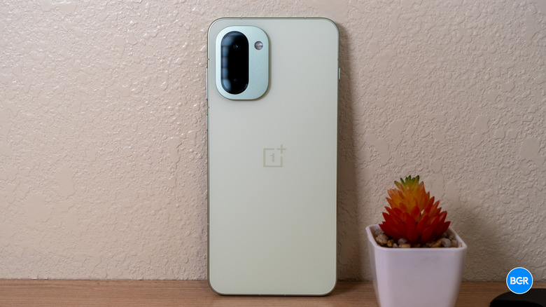 The rear view of the OnePlus 15R highlighting its frosted glass texture.