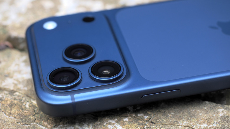 A macro shot of the triple-lens rear camera array on the iPhone 17 Pro.