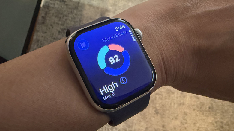 Apple Watch screen displaying a Sleep Score and sleep stage breakdown.