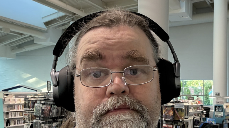 Side profile view of a man wearing the Baseus Inspire XH1.