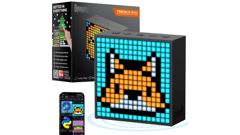 The Divoom TimeBox Evo speaker shown next to its packaging and a smartphone displaying the pixel art design app.