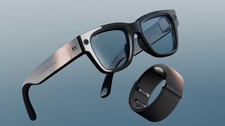 Meta Ray-Ban Display glasses and the sEMG Neural Band side-by-side on a flat surface.