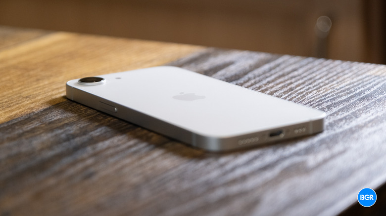 Side profile view of the iPhone 17e on a table.