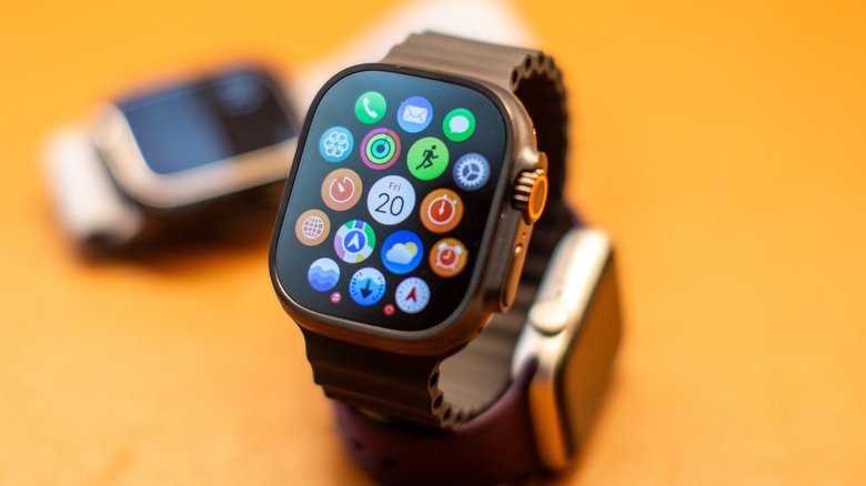 A close-up view of an Apple Watch showing its physical buttons and crown.