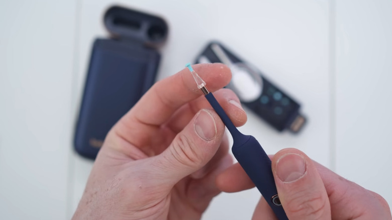 The Bebird ear wax remover tool highlighting its slim 3.6mm lens and 2K camera.