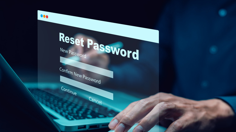 A person using a laptop to update account security settings and reset a password.