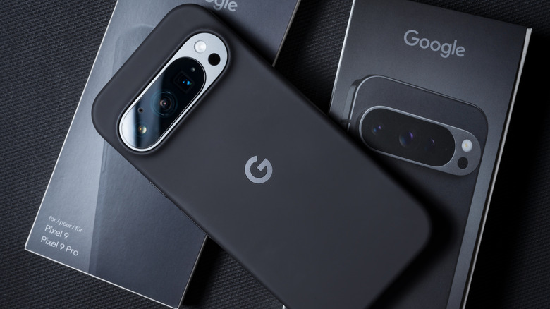 Google Pixel phone placed next to its minimalist retail packaging.