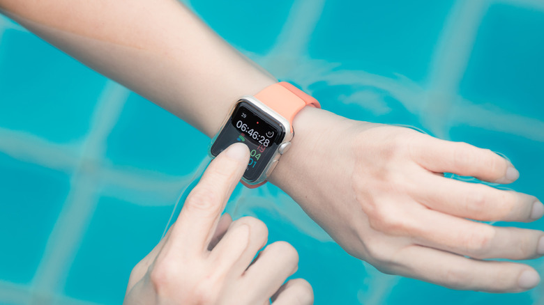 An Apple Watch partially submerged in water to demonstrate its water-resistant build.