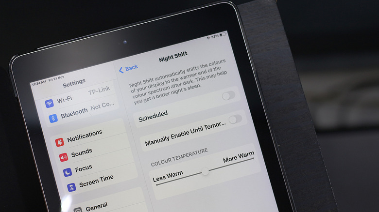 The Night Shift settings screen on an iPad with color temperature slider.