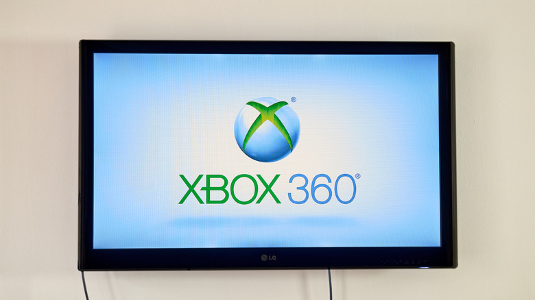 An Xbox 360 logo displayed on a large modern flat-screen TV.